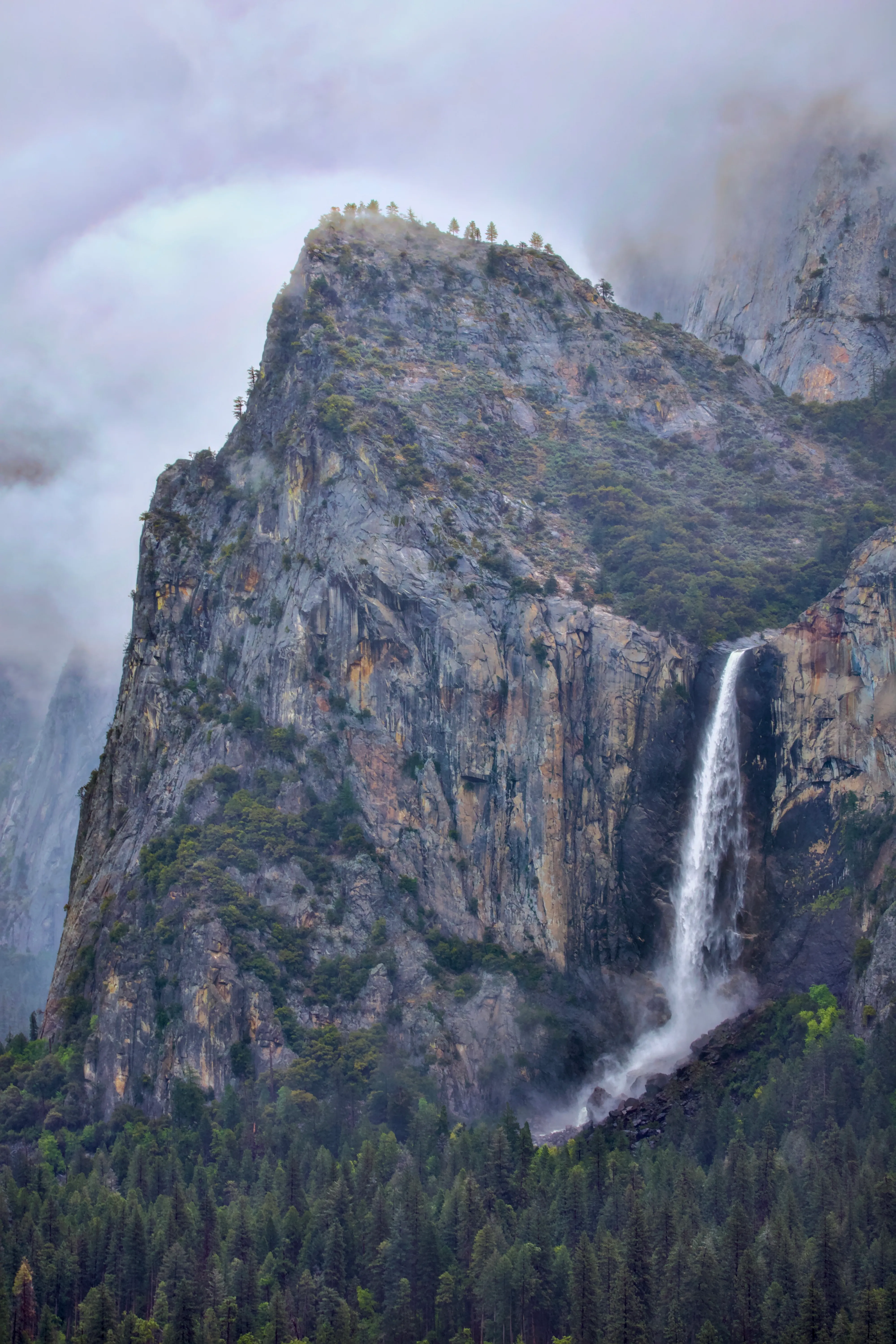 Bridalveil Fall cascading through morning mist in Yosemite